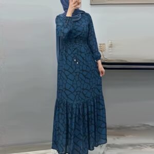 Élégante robe longue avec une taille à cordon de serrage, présentant des couleurs et des imprimés contrastés, parfaite pour les réunions décontractées et les vacances, conçue pour les femmes musulmanes du moyen orient (foulard non inclus).